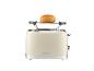 Ein cremefarbener Toaster mit einem Brötchen darauf.