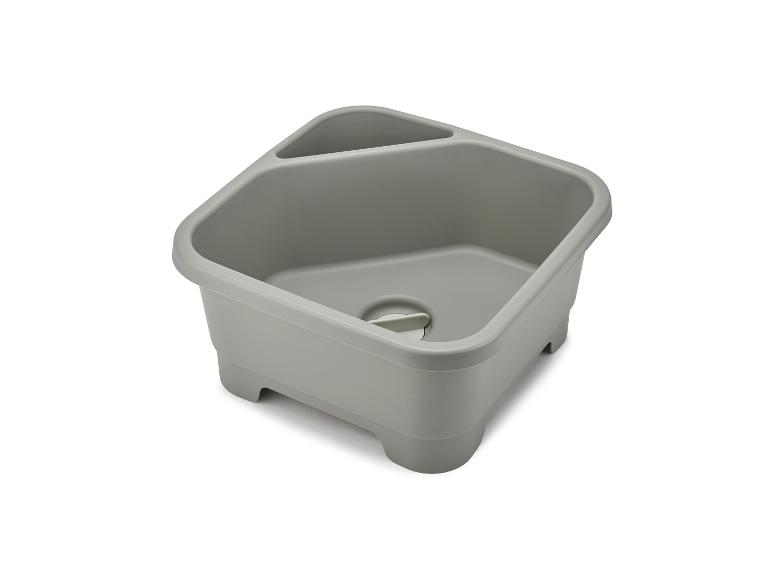 Graue Plastikspüle und Abtropfbecken.