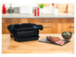 Ein OptiGrill Elite Grill mit gegrilltem Steak und Salat.