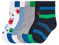 Ein Set mit fünf Paar Socken für Jungen mit Monstern, Streifen und unifarben.