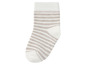 Weiße Socke mit beige Streifen.