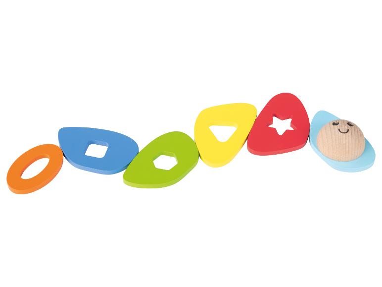 Buntes Holzspielzeug mit geometrischen Formen und einem lächelnden Gesicht.