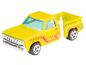 Ein gelber Hot Wheels Dodge Pick-up.