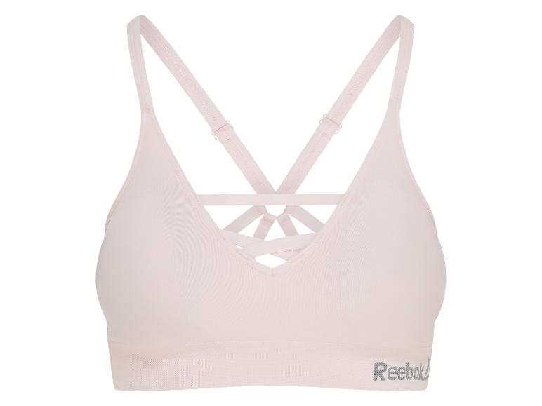 Hellrosa Sport-BH mit überkreuzten Trägern und Textlogo.