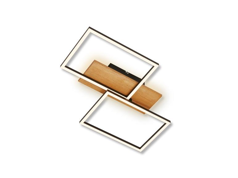 Eine moderne Wandleuchte mit zwei beleuchteten Rahmen und einer Holzbasis.