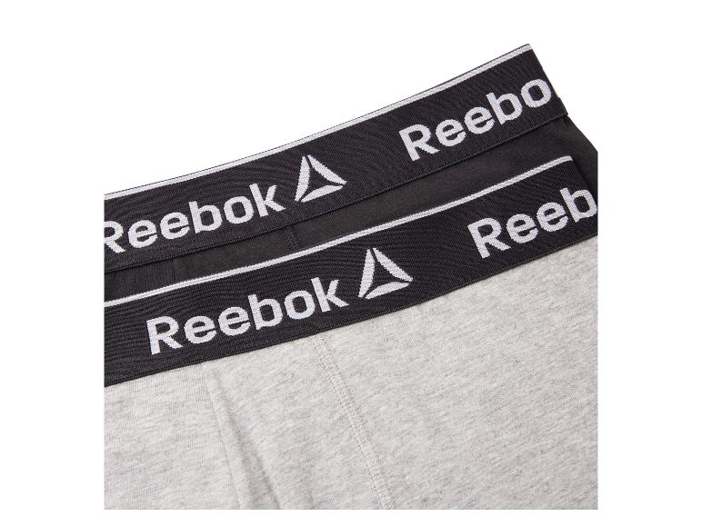 Graue und schwarze Reebok Boxershorts mit Logo am Bund.