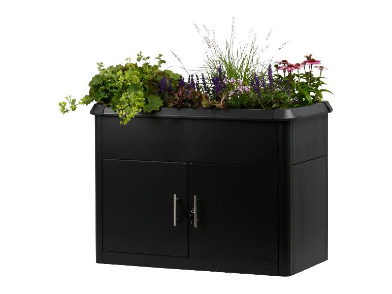 Schwarzer Aufbewahrungsschrank mit Pflanzen und Blumen oben.