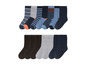 Ein Set mit gestreiften Socken für Jungen in Blau, Grau und Schwarz.
