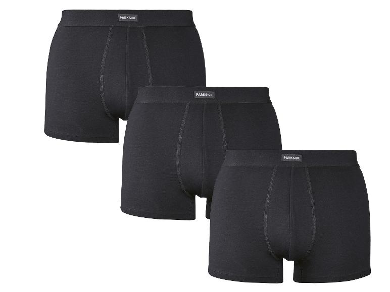 Drei schwarze Herren-Boxershorts mit sichtbarem Bund.