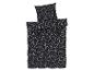 Ein schwarzer Bettbezug und ein Kissenbezug mit einem weißen Herzmuster.