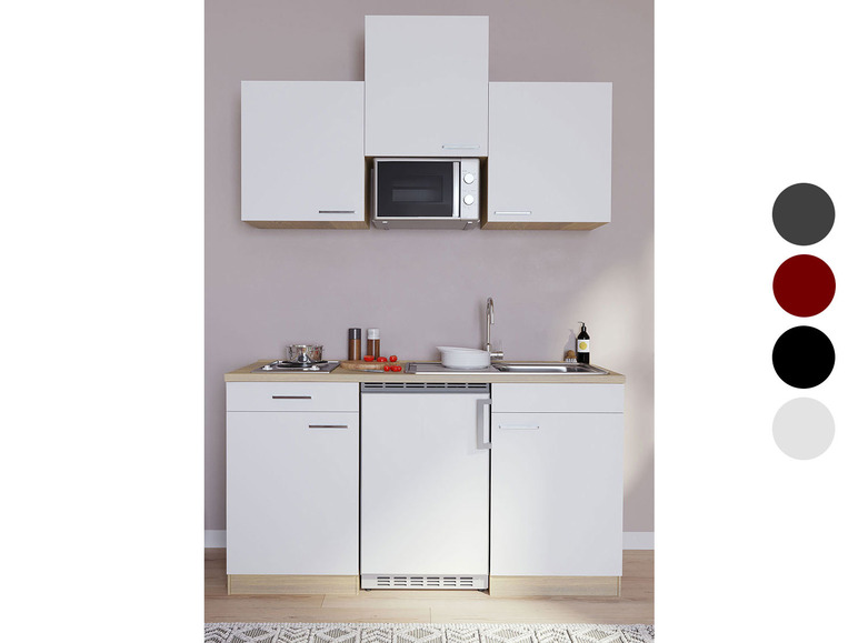 Weißes Küchenblock mit integriertem Kühlschrank, Spüle und Mikrowelle.