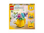 LEGO Creator 3-in-1-Set mit einer Gießkanne mit Blumen, Vögeln und einem Stiefel.