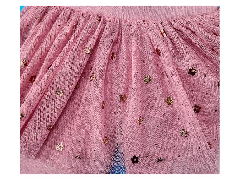 Nahaufnahme eines rosa Tüllrocks mit goldenem Glitzer und Blumendetails