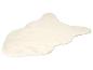 Cremefarbener Kunstfellteppich mit unregelmäßiger Form
