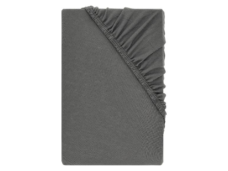 Dunkelgraues Spannbettlaken mit Gummizug, mit geraffter rechter oberer Ecke