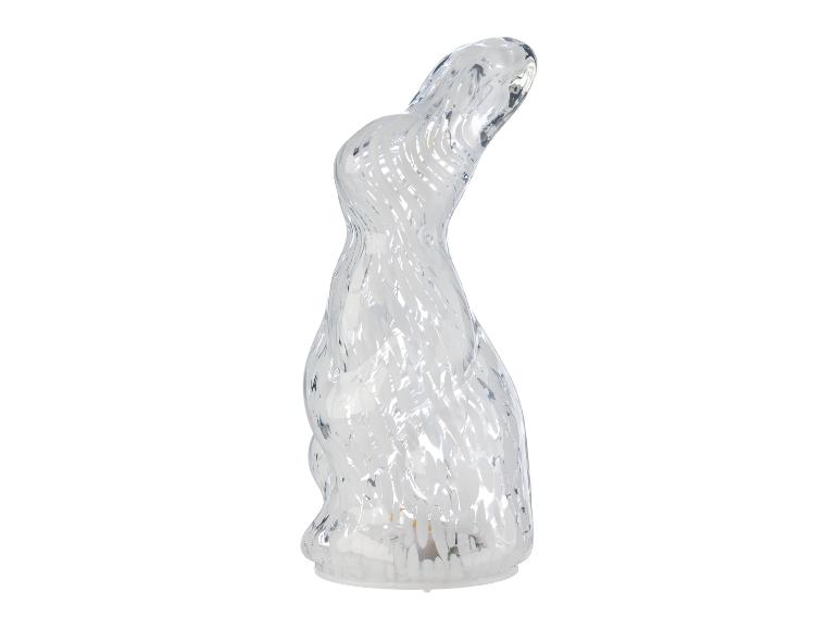Ein transparenter, glänzender Osterhase aus Glas mit weißen Wirbeln.