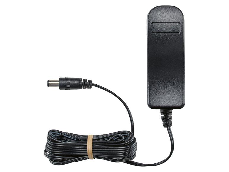 Schwarzes Netzteil mit aufgerolltem Kabel und Hohlstecker