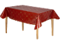 Rote Tischdecke mit goldenen Weihnachtsmotiven auf einem Holztisch.