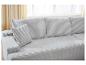 Hellgraues Modulsofa mit gerippten Samtkissen in einem hellen Wohnzimmer.