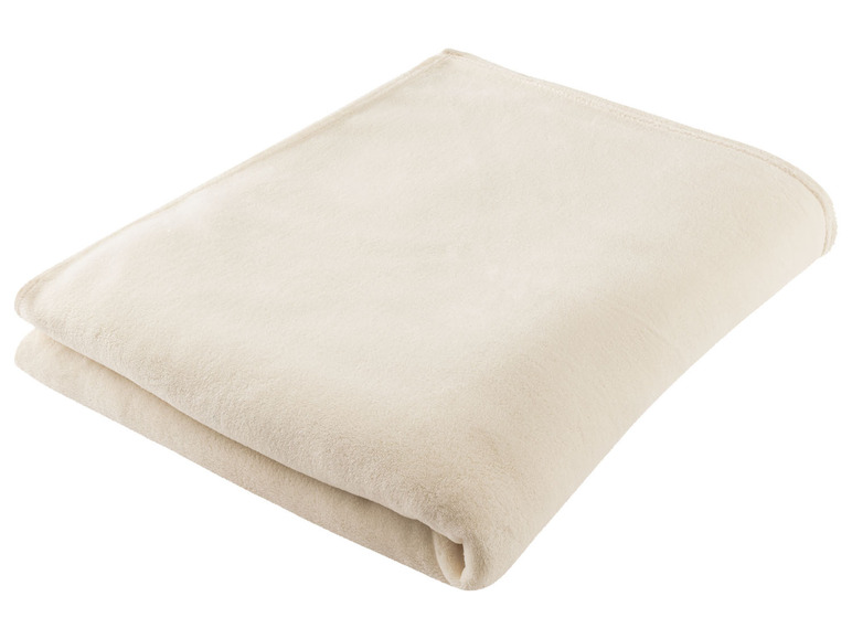 Eine gefaltete cremefarbene Decke.