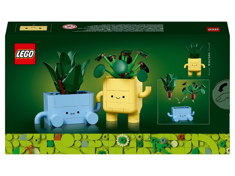 LEGO Set mit zwei baubaren Pflanzen, einer blauen und einer gelben, mit lächelnden Gesichtern.