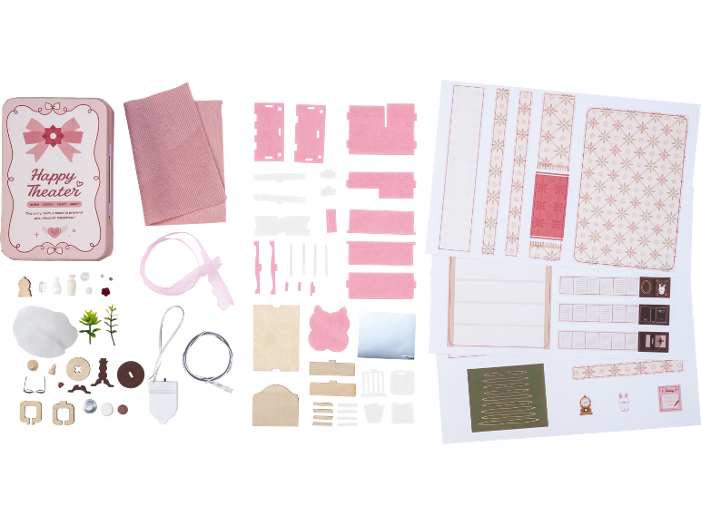 DIY Miniaturzimmer-Bausatz mit rosa Blechdose, Holzteilen, Stoff und Papierausschnitten.