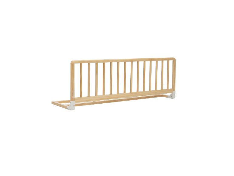 Bettgitter aus Holz mit weißen Befestigungen.