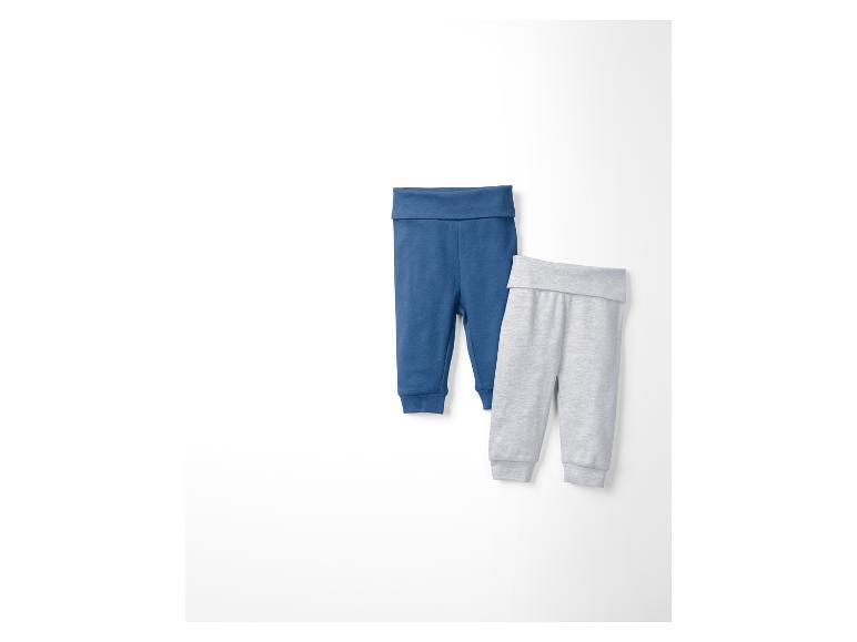 Zwei Babyhosen, eine blaue und eine graue.