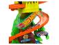 Hot Wheels Spielset mit Dinosaurier-Thema und Rennautos.