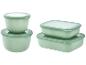 Set grüner Lebensmittelbehälter: zwei rechteckige und zwei runde.