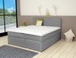 Ein graues Boxspringbett mit Matratze und Kopfteil.