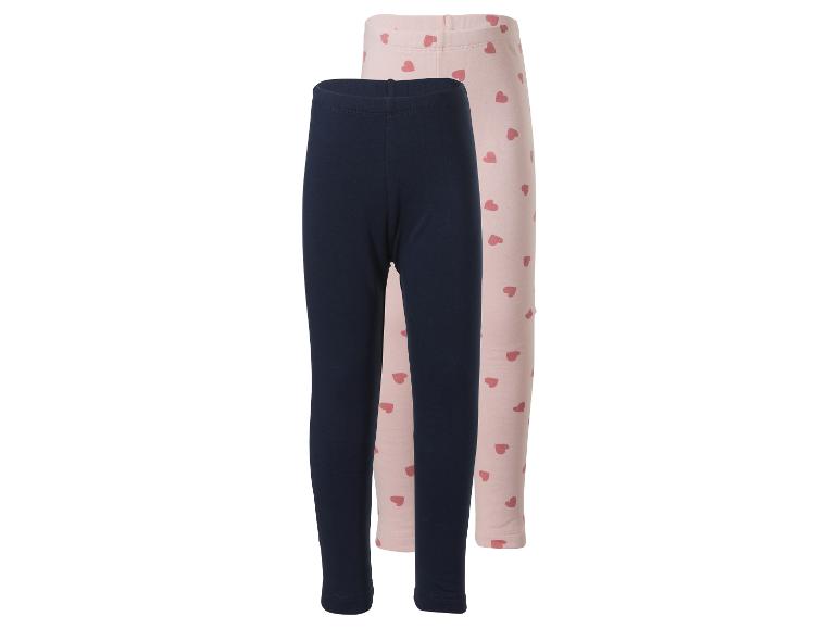 Zwei Kinderleggings: dunkelblau und rosa mit Herzen