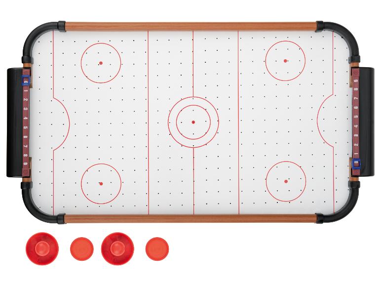 Airhockey-Tisch mit roten Pucks und Punktezählern.