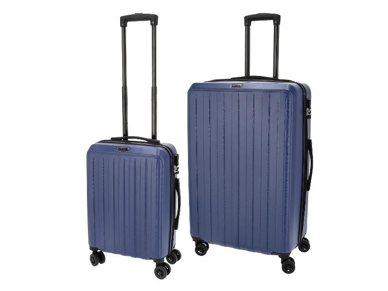 Zwei blaue Hartschalenkoffer mit Teleskopgriffen und Spinner-Rädern.