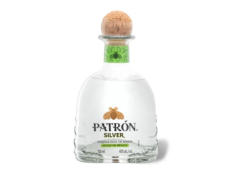 Silberne Tequila-Flasche mit grünem Etikett und Korkverschluss.