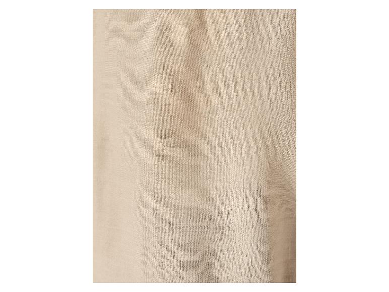 Nahaufnahme eines beigefarbenen Gewebes.