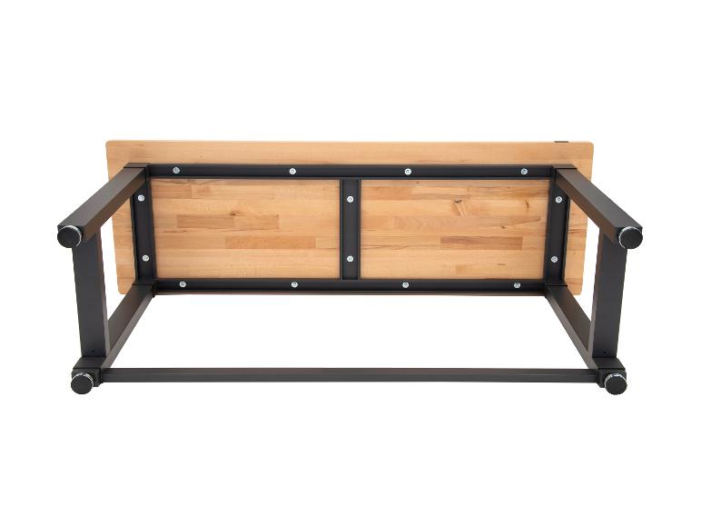 Holztischplatte mit schwarzem Metallrahmen, von unten gesehen.