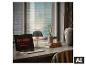 Laptop mit 'Light. Inspired by life.' Text, Schreibtischlampe und Deko am Fenster.