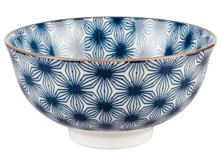 Eine weiße Schüssel mit einem blauen geometrischen Muster.
