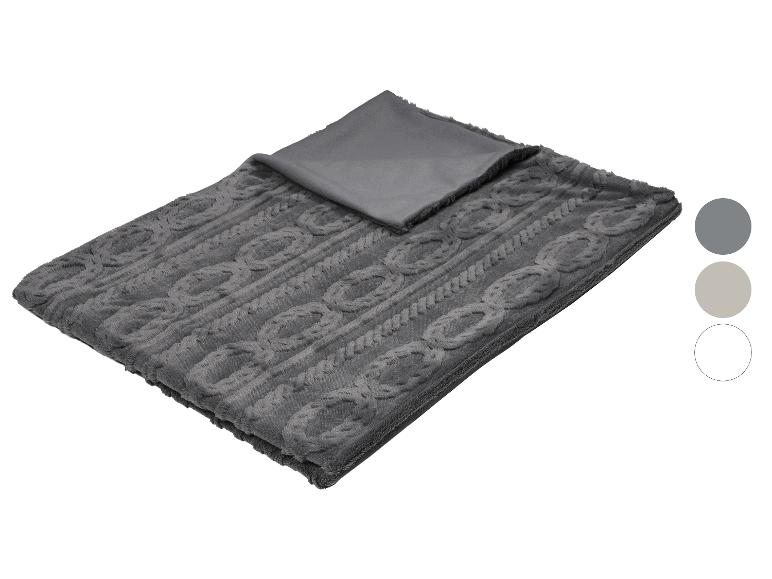 Eine graue Decke mit Zopfmuster und glatter grauer Unterseite, gezeigt mit Farbmustern.