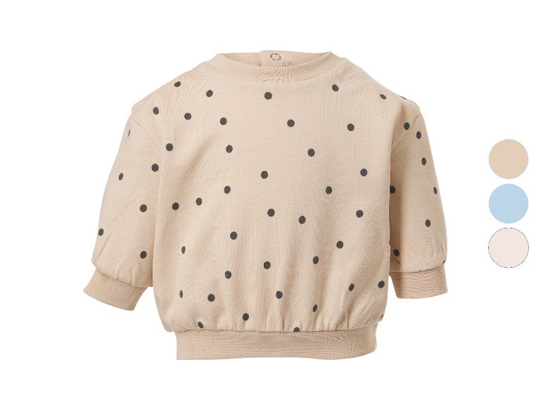 Beiges Baby-Sweatshirt mit schwarzen Punkten und drei Farboptionen.