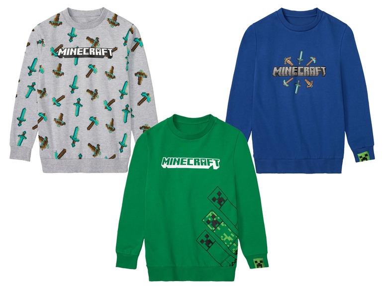 Drei Minecraft-Pullover mit verschiedenen Designs.