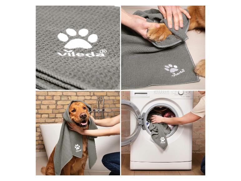 Graues Vileda Haustierhandtuch mit Pfotenabdruck, zum Trocknen eines Hundes verwendet und in der Waschmaschine gewaschen.