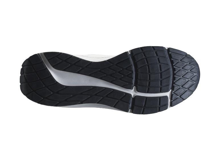 Unterseite einer schwarz-weißen Laufschuhsohle mit strukturiertem Muster.