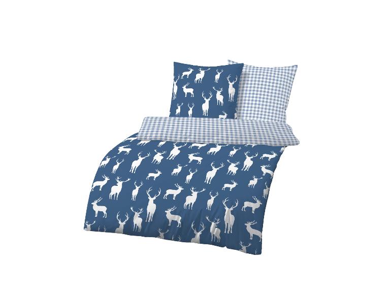 Blaue Bettwäsche mit Hirsch-Muster und einem karierten Kissen