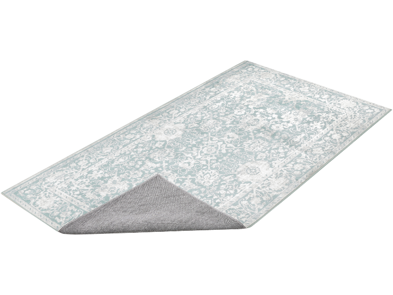 Rechteckiger Teppich mit Blumenmuster in Mintgrün und Weiß, mit sichtbarer rutschfester Unterseite.