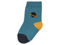 Eine blaue Socke mit einem Planetenmuster.