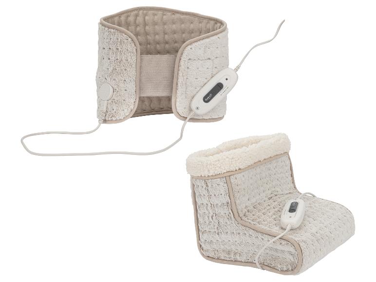 Elektrisches Heizkissen und Plüsch-Fußwärmer, beide in Beige.
