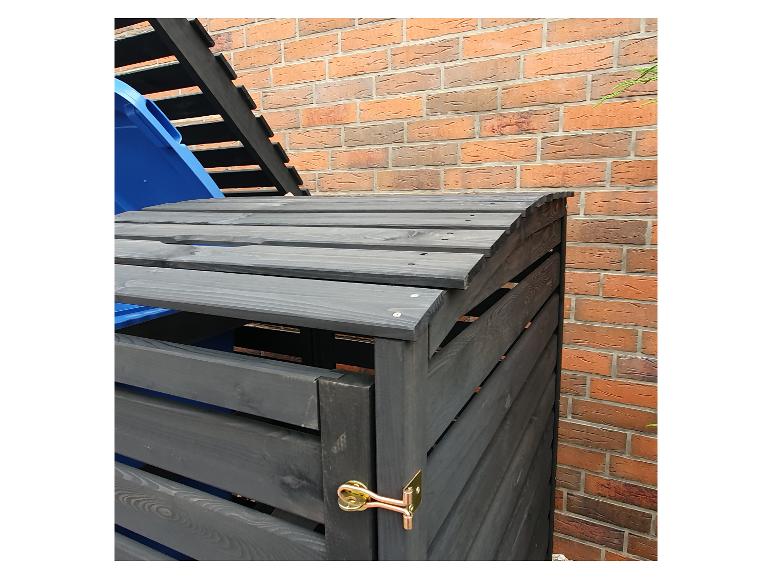 Ein Holzcontainer für Müll mit Deckel und Schloss.