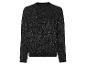 Ein schwarzer Pullover mit Glitzerfaden.